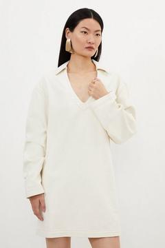 Oferta de Denim Long Sleeve Mini Smock Dress por 63,2€ en Karen Millen