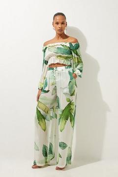 Oferta de Tropical Palm Print Wide Leg Beach Trousers por 81,75€ en Karen Millen