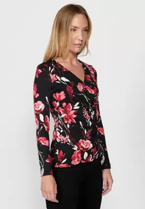 Oferta de Camiseta de manga larga y escote cruzado con pieza lateral y estampado flor grande de color negro para mujer por 39,99€ en Koröshi