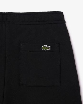 Oferta de Pantalón corto en felpa con insignia de cocodrilo por 50€ en Lacoste