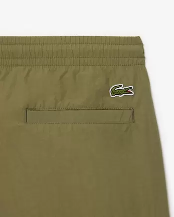 Oferta de Pantalón corto de corte holgado con bolsillo con cremallera por 100€ en Lacoste