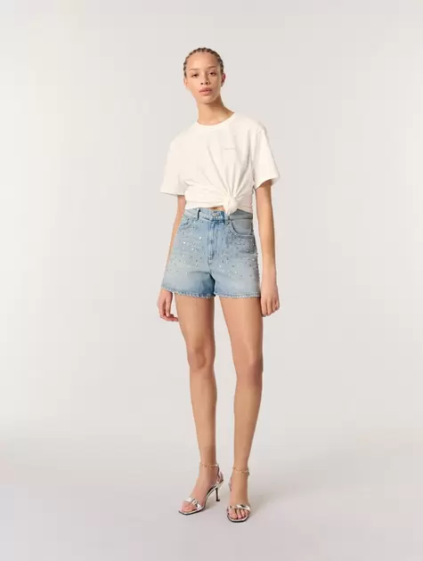 Oferta de Pantalón corto vaquero con tachuelas por 156€ en Maje