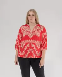 Oferta de BLUSA ESTAMPADA DE CUELLO REDONDO Y ABERTURAEN PICO ROJO por 35,99€ en October