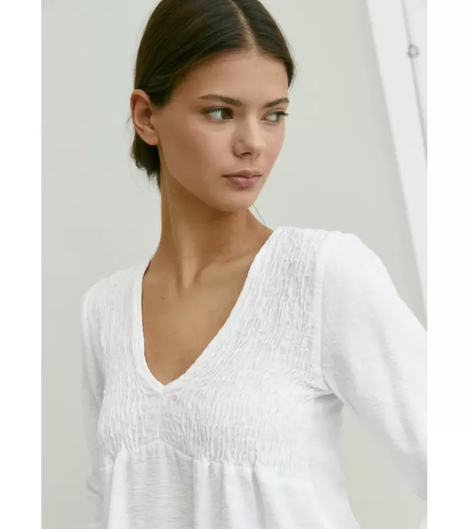 Oferta de BLUSA TEXTURA NIDO DE ABEJA por 24,99€ en Mulaya