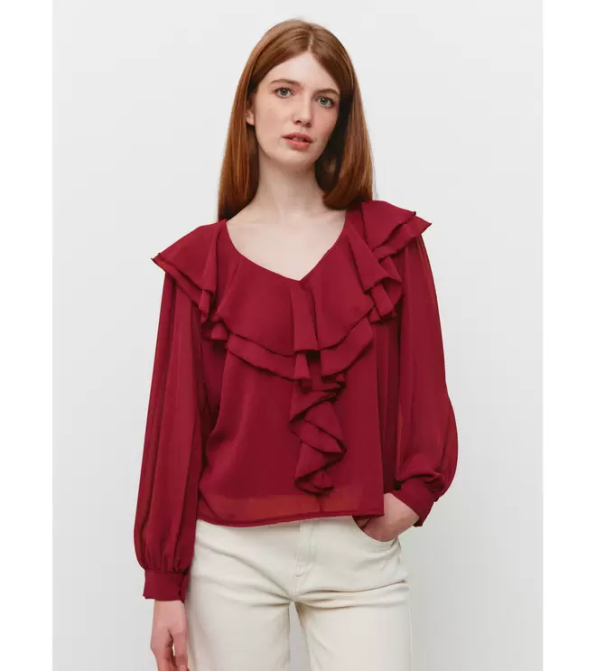 Oferta de BLUSA VOLANTES ESCOTE PICO por 17,99€ en Mulaya