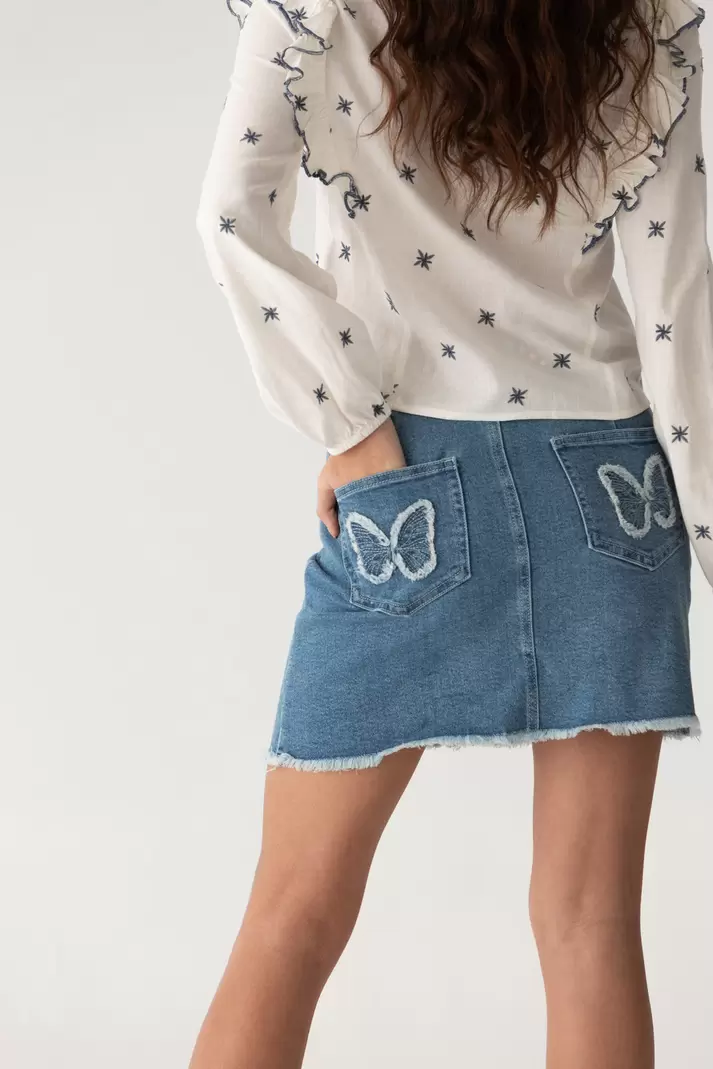 Oferta de FALDA MINI MARIPOSAS DENIM por 45€ en Noon