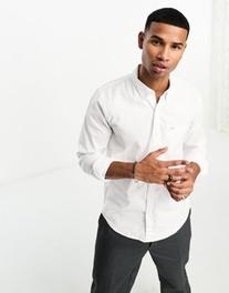 Oferta de Camisa Oxford blanca con bolsillo y logo de Hollister por 26,25€ en Asos