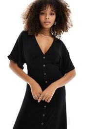 Oferta de Vestido de tarde midi negro con botones delanteros y mangas vueltas de ASOS DESIGN por 32,99€ en Asos