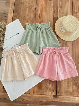 Oferta de Set de 3 pantalones cortos de niña preadolescente de cintura elástica de unicolor, 100% algodón gasa doble, transpirable, con decoración de lazo dulce en la cintura, de verano por 16,99€ en SheIn