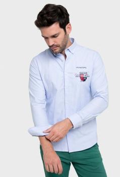 Oferta de Camisa Polo Team bordada color celeste por 55,93€ en Valecuatro