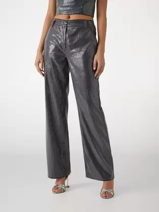 Oferta de Pantalón con lentejuelas Cassia por 150€ en Guess