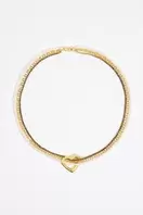 Oferta de Collar corazón multicadenas perlas y cristales dorado por 40,6€ en Bimba & Lola