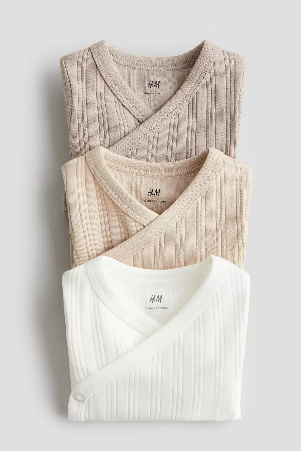 Oferta de Pack de 3 bodies cruzados de canalé por 17,99€ en H&M