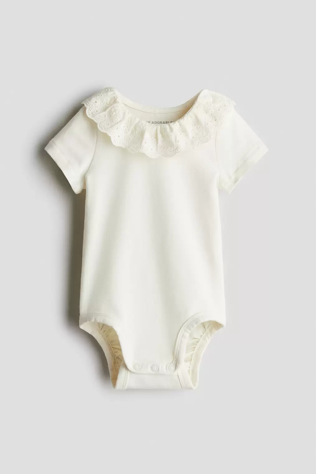 Oferta de Body de algodón con cuello en bordado inglés por 12,99€ en H&M