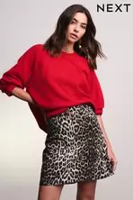 Oferta de Estampado de leopardo - Denim Mini Skirt por 48€ en Next