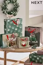 Oferta de Bolsas de regalo de Navidad por 7€ en Next